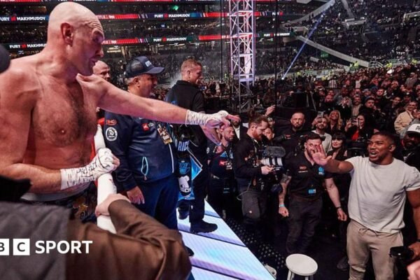 Tyson Fury and Anthony Joshua exchange words