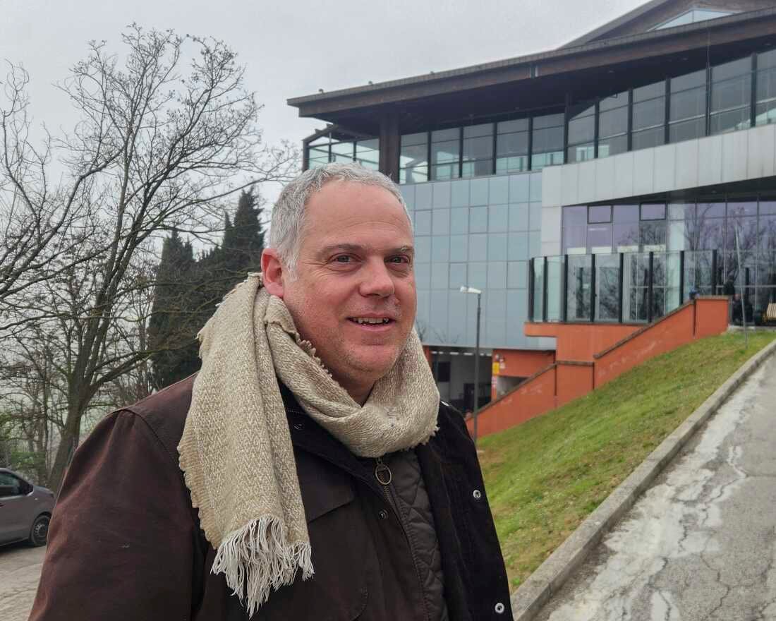 Matteo Diotalevi stands outside the modern dining hall which sits at the center of San Patrignano, where he has worked for fifteen years. Many of the 850 people who live in the addiction treatment community gather here daily for shared meals. "We help people find another chance," Diotalevi said.