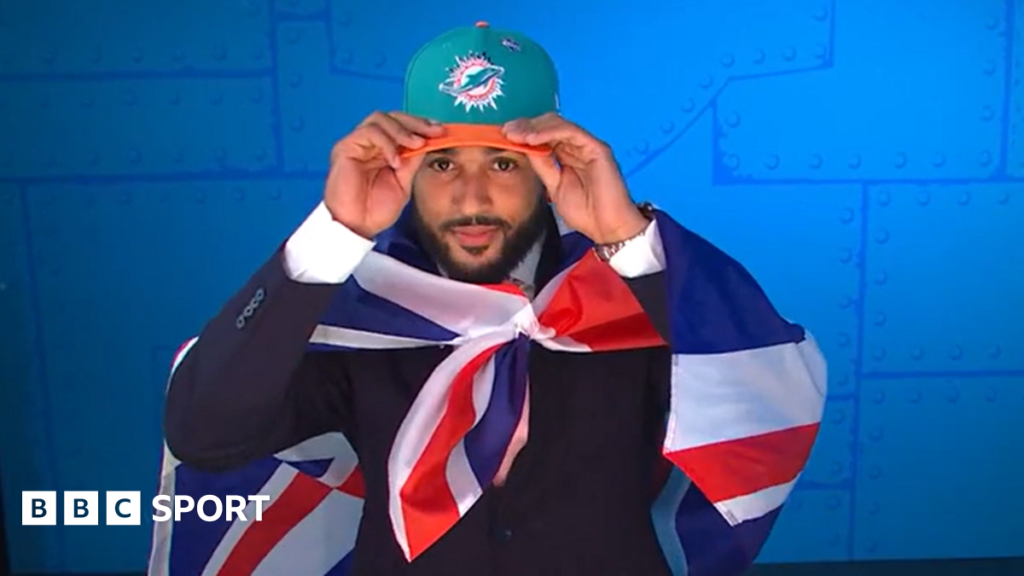 Uar Bernard, seen wearing a cropped black support vest over his upper chest