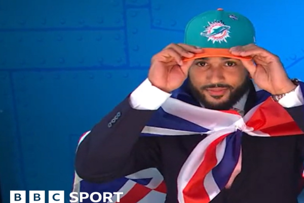 Uar Bernard, seen wearing a cropped black support vest over his upper chest