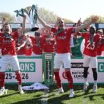 Ollie Pearce and Callum Howe of York City lift the National League Trophy after the 1-1 draw at Rochdale