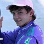Mercedes' Kimi Antoenlli looks back, smiles and gives the thumbs-up signal after taking pole position for the Miami Grand Prix