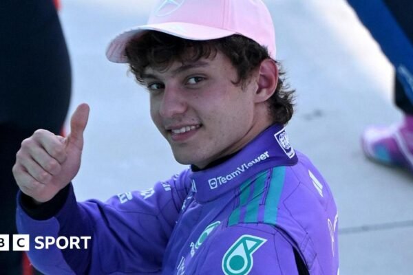 Mercedes' Kimi Antoenlli looks back, smiles and gives the thumbs-up signal after taking pole position for the Miami Grand Prix