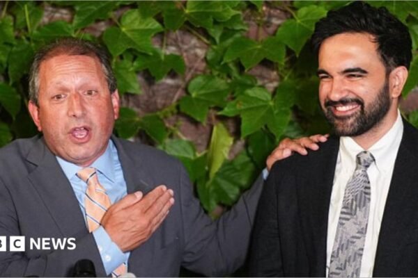 Brad Lander, candidate for New York’s 10th Congressional District, stands next to New York City Mayor Zohran Mamdani during a watch party after winning the primary elections in Brooklyn, New York