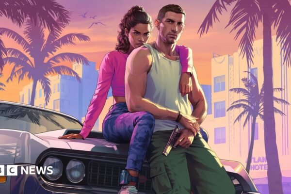 Cover art of the two protagonists in the game, Jason and Lucia, sitting against a car. Jason is in a white tank top and green trousers and is holding a gun. Lucia is behind him with an arm around his shoulder and wearing a pink top and grey trousers.