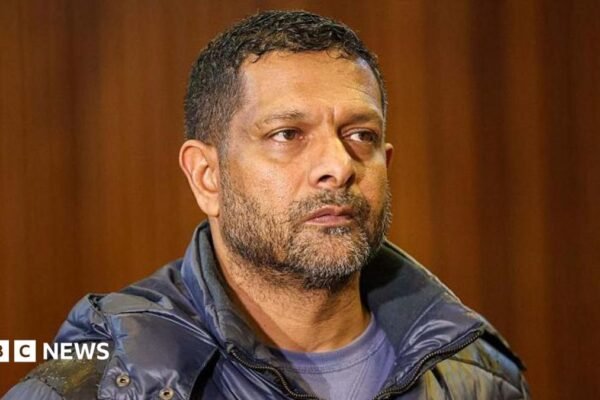 South Africa's deputy head of crime intelligence Feroz Khan is seen in court. He has short hair and a short beard