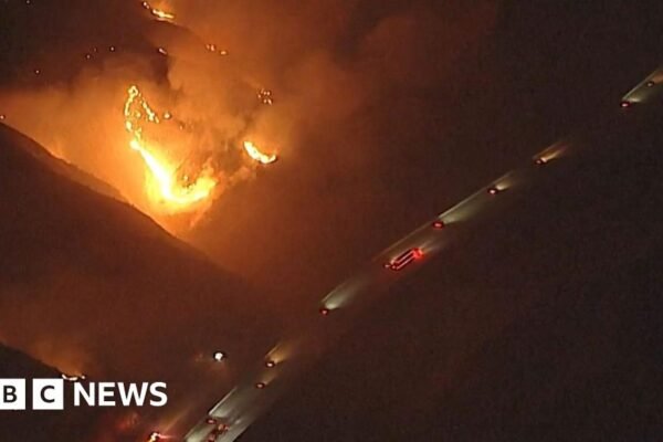 Watch: California wildfires rage near passing vehicles