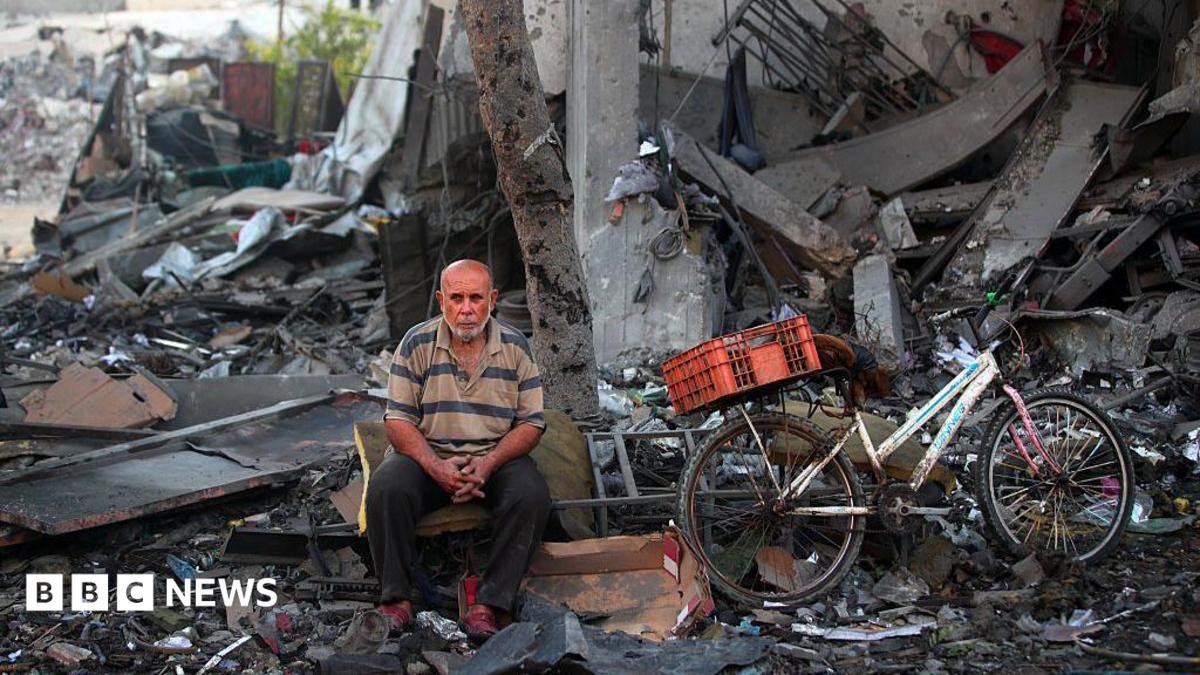 A Palestinian man rests amid debris at the site of an Israeli strike on a house in Gaza City, on July 30, 2026.