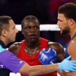 Aziz Abdul reacts after being disqualified for a headbutt during fight against England's Damar Thomas