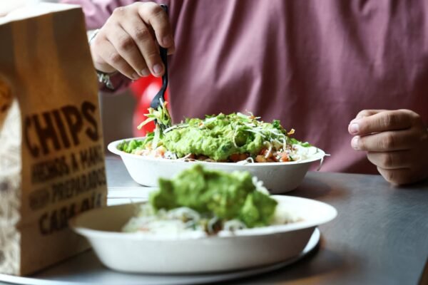 Chipotle hikes same-store sales forecast, says cyclospora fears hit sales in late July