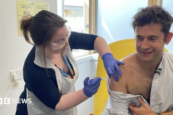 First person gets new experimental vaccine for Ebola