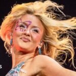Festival-goers with glitter  and neon make-up and hair