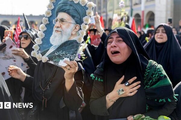 A woman weeps as people gather at the Imam Khomeini Grand Mosalla for a farewell ceremony for Iran's late Ayatollah Ali Khamenei