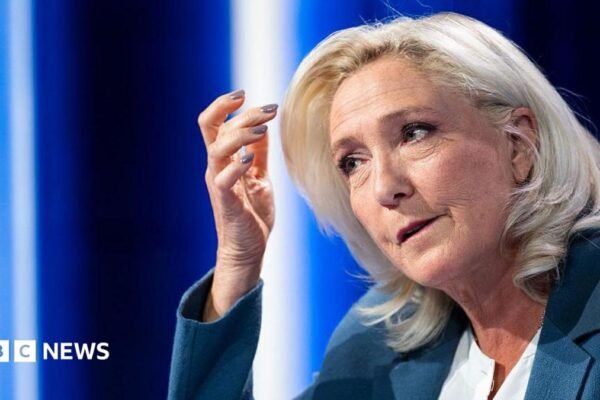 President of Rassemblement National parliamentary group Marine Le Pen poses poses ahead of a television interview entitled "Le Grand Entretien" broadcast on French news channel LCI, in Boulogne-Billancourt, southern of Paris on July 1, 2026