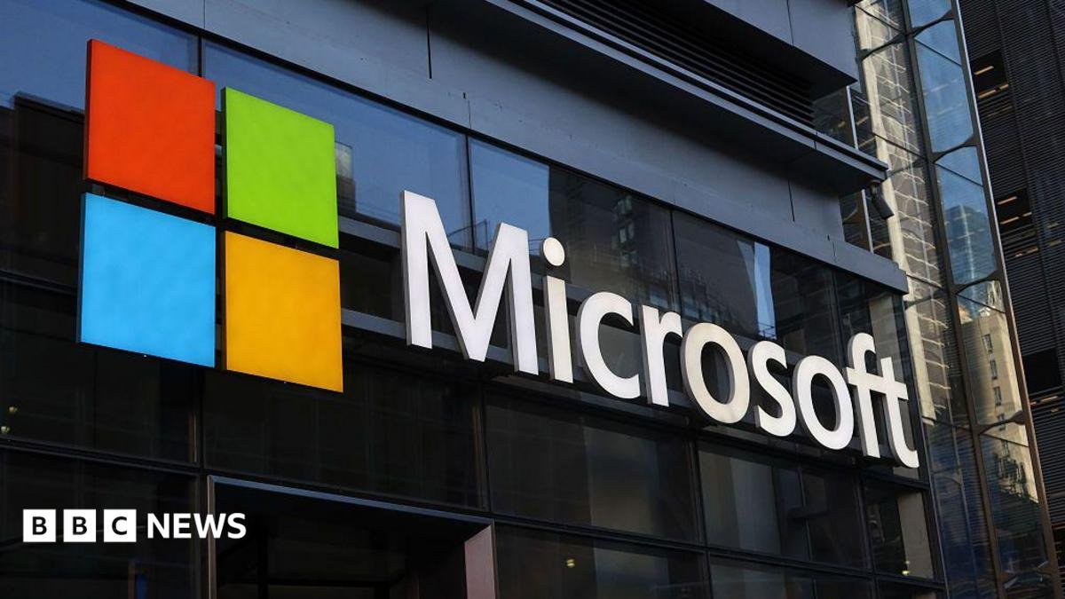 A Microsoft building with a sign bearing the company's logo