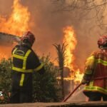 A firefighting crew deployed to battle a wildfire spreading in Lege-Cap-Ferret, south western France, late 24 July 2026.