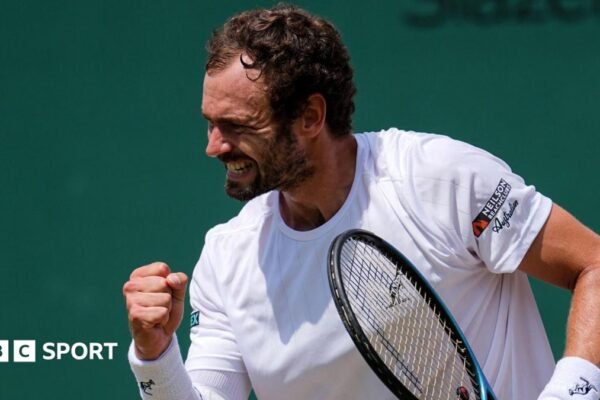 Roman Safiullin celebrates after defeating Joao Fonseca