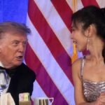 Trump reacts next to CBS News senior White House correspondent and White House Correspondents' Association President (WHCA) Weijia Jiang at the WHCA Dinner