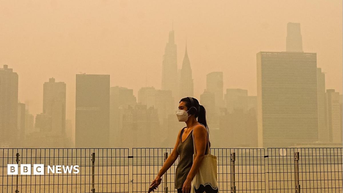 Smoke from massive wildfires in Canada engulfed the New York City skyline, reducing visibility and casting an orange haze over the New York City