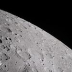 A cratered section of the moon is seen close-up