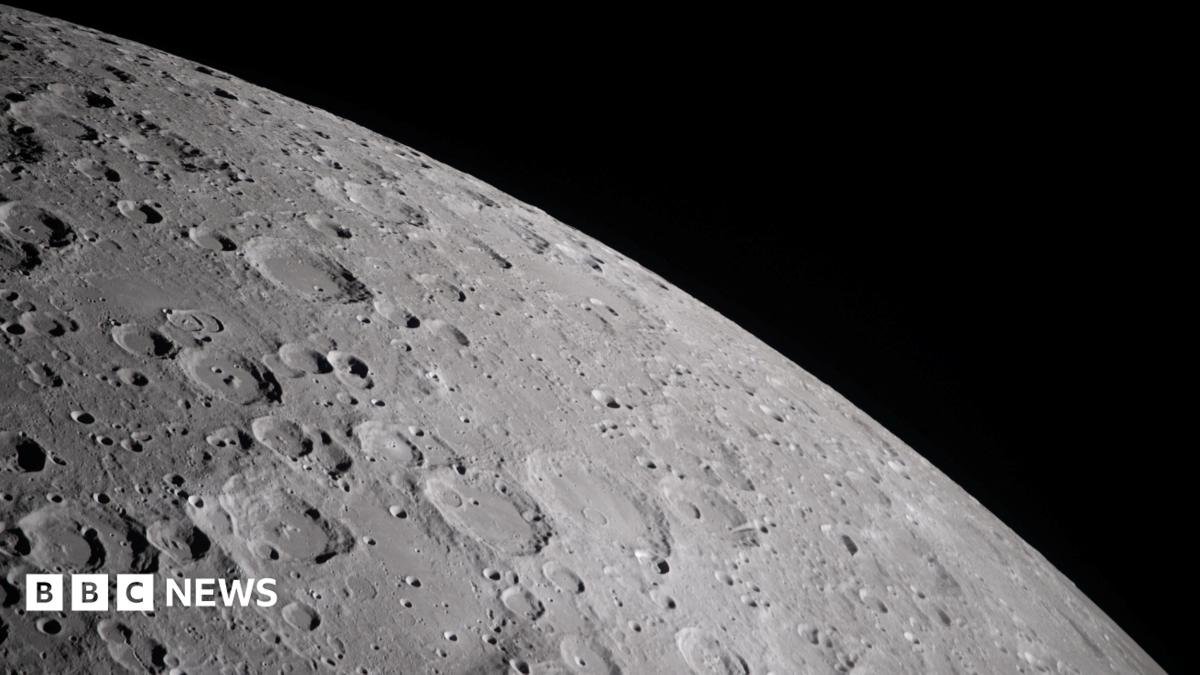 A cratered section of the moon is seen close-up